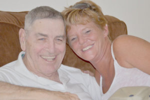 two elderly smiling