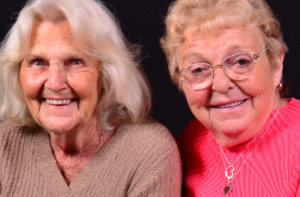 two elderly smiling